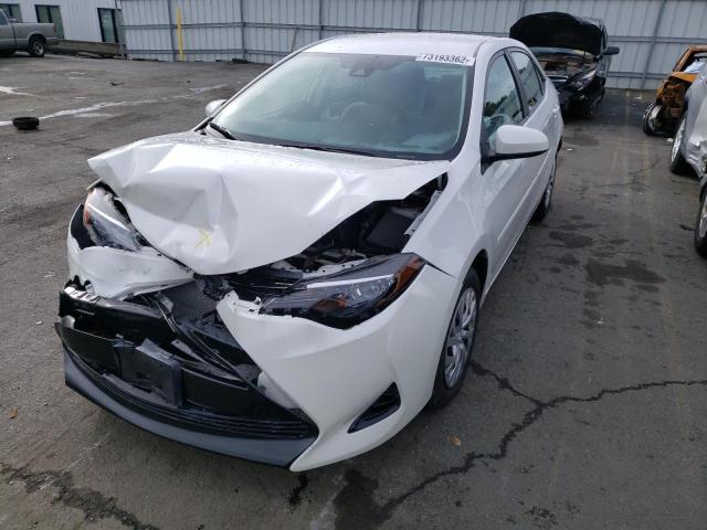 TOYOTA COROLLA L 2018 with VIN 5YFBURHE4JP839545 - Photo from auction