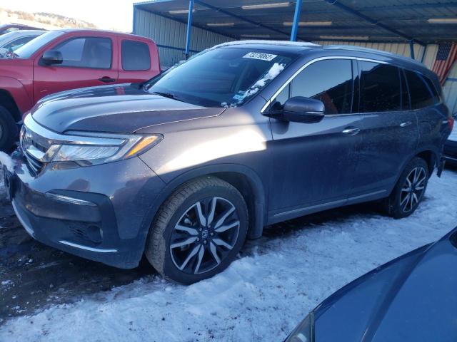 HONDA PILOT TOUR 2020 with VIN 5FNYF6H90LB052449 - Photo from auction