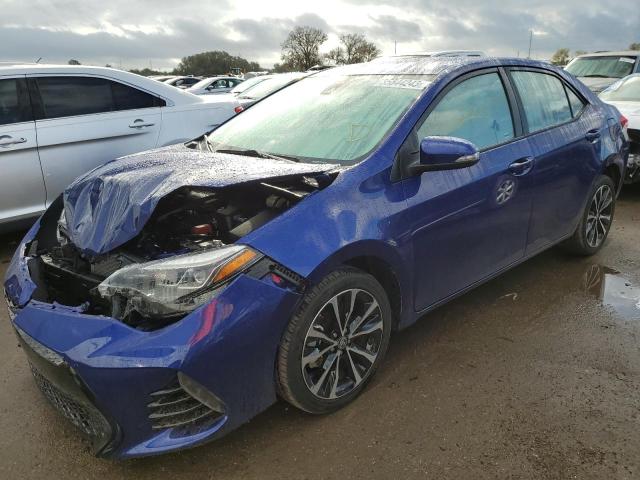 TOYOTA COROLLA L 2019 with VIN 5YFBURHE9KP869982 - Photo from auction