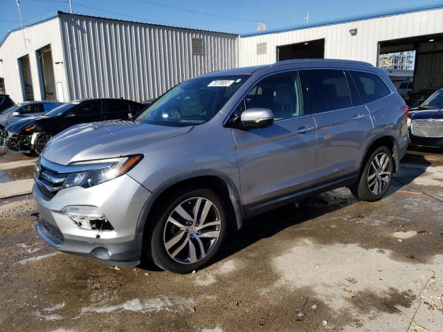 HONDA PILOT TOUR 2018 with VIN 5FNYF5H96JB006079 - Photo from auction