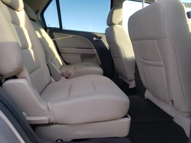 Photo 11 from auction – 2009 FORD TAURUS X S with VIN 1FMDK02W29GA02460