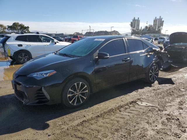 TOYOTA COROLLA L 2018 with VIN 5YFBURHE7JP796254 - Photo from auction