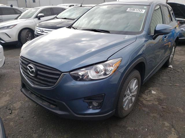 MAZDA CX-5 TOURI 2016 with VIN JM3KE2CY5G0654890 - Photo from auction