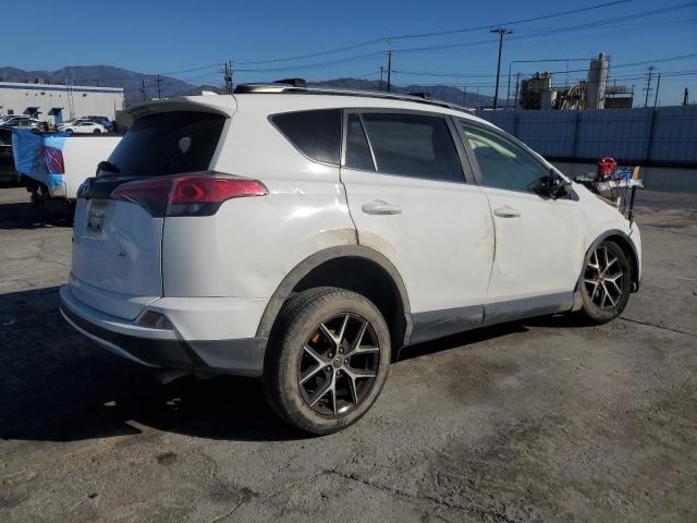 Photo 3 from auction – 2018 TOYOTA RAV4 SE with VIN JTMNFREV1JJ192117