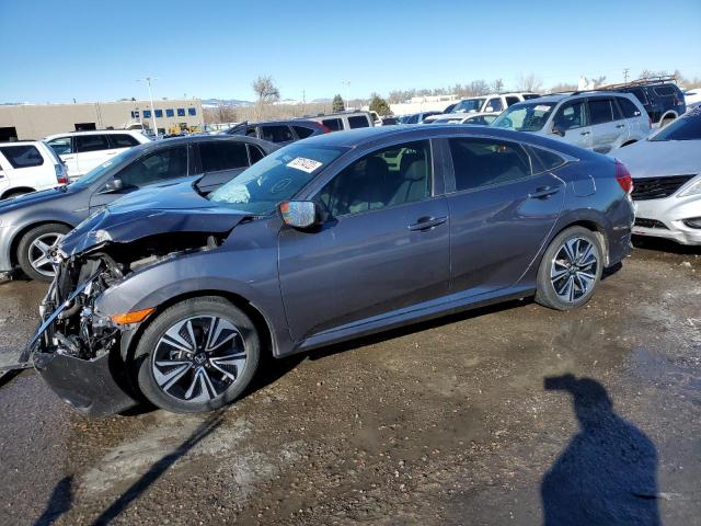 HONDA CIVIC EXL 2018 with VIN JHMFC1F73JX038583 - Photo from auction