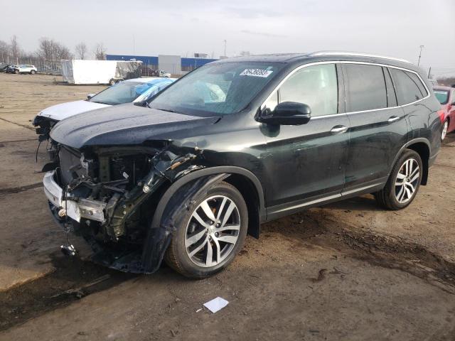HONDA PILOT TOUR 2018 with VIN 5FNYF6H97JB012379 - Photo from auction