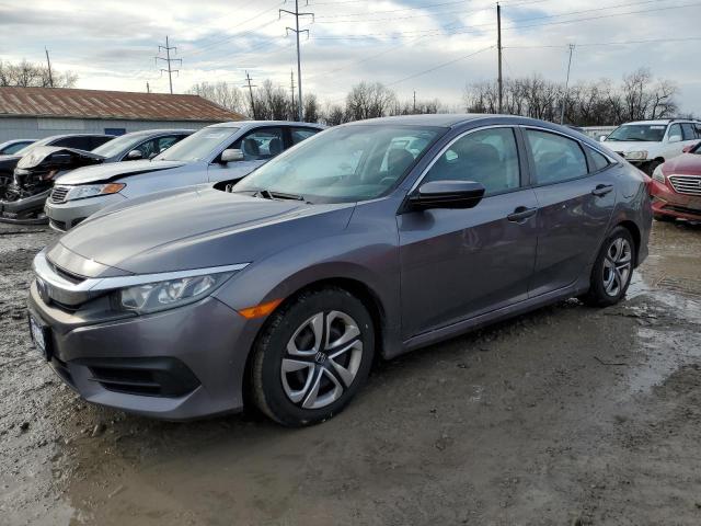 HONDA CIVIC LX 2018 with VIN 19XFC2F5XJE013461 - Photo from auction