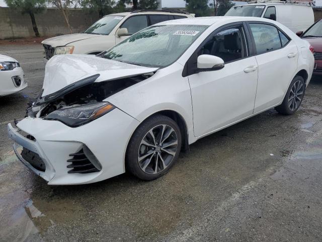 TOYOTA COROLLA L 2017 with VIN 5YFBURHE9HP701199 - Photo from auction