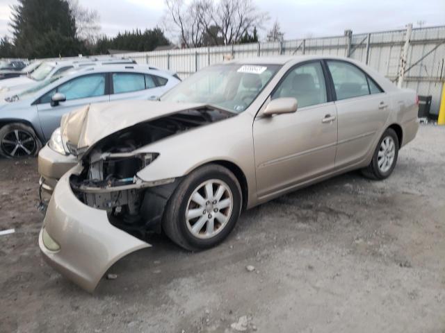 TOYOTA CAMRY LE 2004 with VIN 4T1BF30K64U587812 - Photo from auction