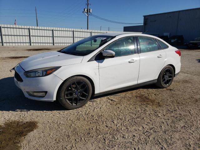 FORD FOCUS SE 2016 with VIN 1FADP3F24GL299711 - Photo from auction