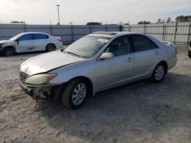 TOYOTA CAMRY LE 2004 with VIN 4T1BF32K74U585807 - Photo from auction
