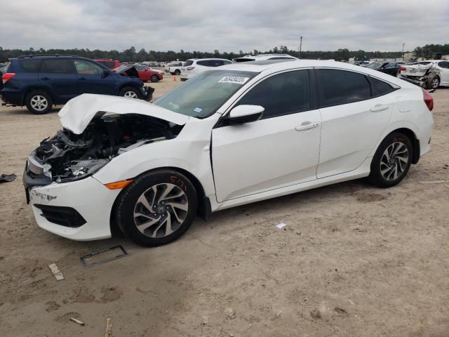 HONDA CIVIC EX 2018 with VIN 19XFC2F74JE006572 - Photo from auction