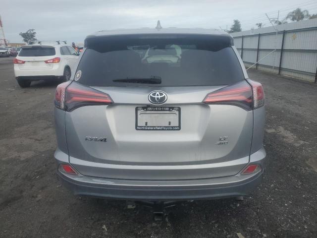 Photo 6 from auction – 2018 TOYOTA RAV4 LE with VIN 2T3BFREV0JW716264