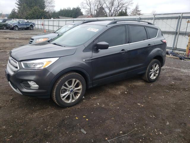 FORD ESCAPE SE 2018 with VIN 1FMCU9GDXJUD06451 - Photo from auction