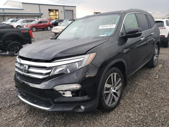 HONDA PILOT TOUR 2017 with VIN 5FNYF5H93HB016384 - Photo from auction