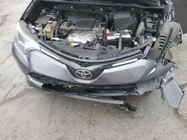 Photo 12 from auction – 2018 TOYOTA RAV4 LE with VIN JTMBFREV4JJ222536