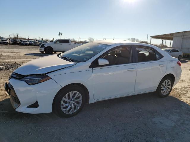 TOYOTA COROLLA L 2017 with VIN 5YFBURHE3HP694587 - Photo from auction