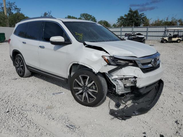 Photo 4 from auction – 2021 HONDA PILOT TOUR with VIN 5FNYF5H92MB010344