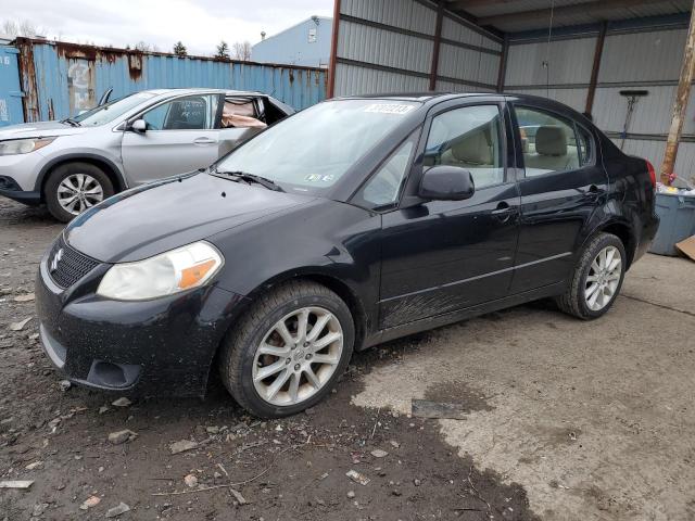 SUZUKI SX4 LE 2011 with VIN JS2YC5A22B6304797 - Photo from auction