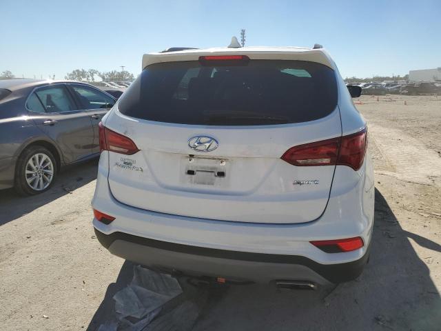 Photo 6 from auction – 2018 HYUNDAI SANTA FE S with VIN 5NMZU3LB9JH094892