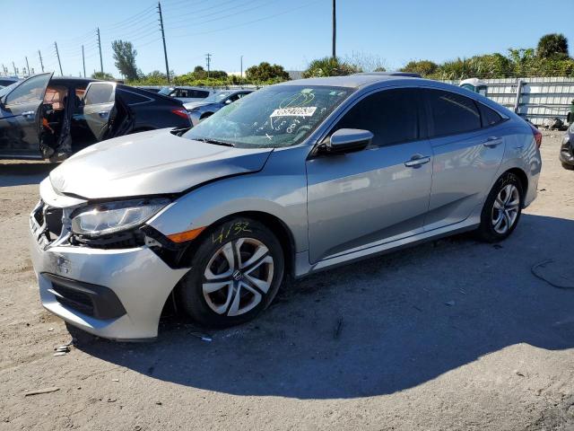 HONDA CIVIC LX 2018 with VIN 19XFC2F5XJE003366 - Photo from auction