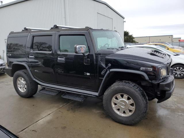 Фото 4 с аукциона – 2004 HUMMER H2 с VIN 5GRGN23U44H102353