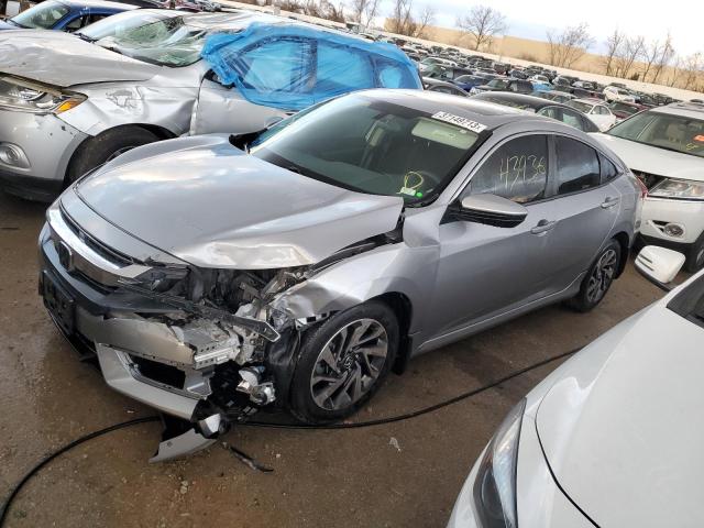 HONDA CIVIC EX 2018 with VIN 19XFC2F7XJE035588 - Photo from auction