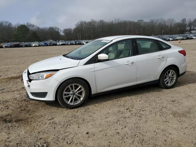 FORD FOCUS SE 2018 with VIN 1FADP3F2XJL234496 - Photo from auction