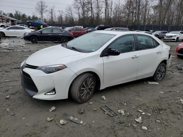 TOYOTA COROLLA L 2018 with VIN 5YFBURHE2JP749679 - Photo from auction