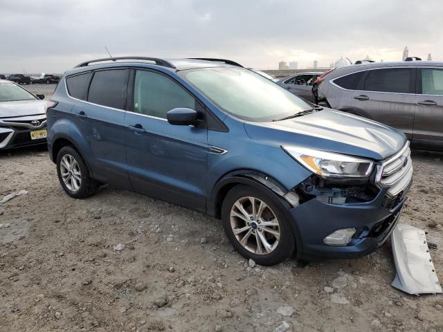 Photo 4 from auction – 2018 FORD ESCAPE SE with VIN 1FMCU0GD8JUC32409