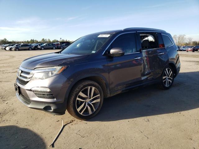 HONDA PILOT TOUR 2017 with VIN 5FNYF5H93HB041611 - Photo from auction