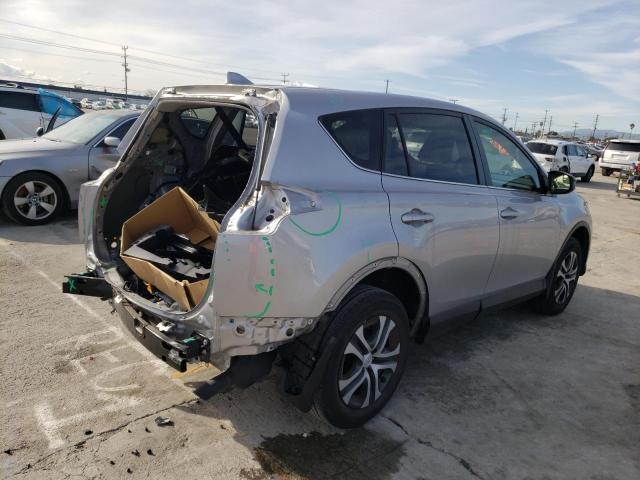 Photo 3 from auction – 2018 TOYOTA RAV4 LE with VIN JTMZFREV5JD126783