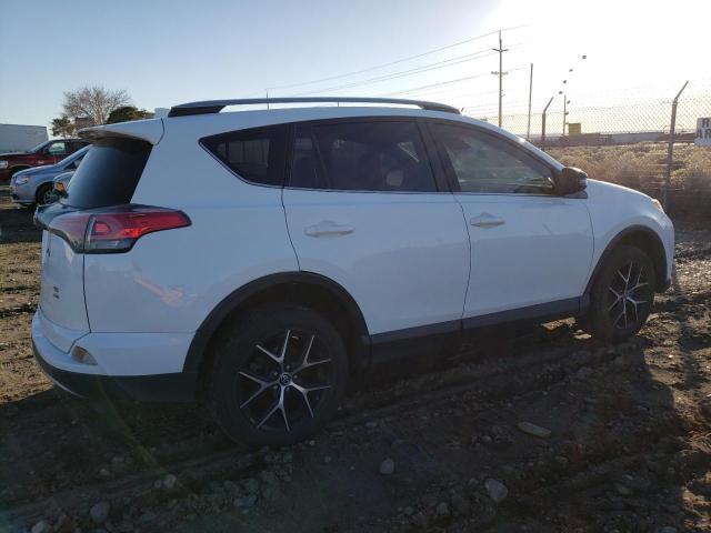 Photo 3 from auction – 2018 TOYOTA RAV4 SE with VIN JTMJFREV7JD232990
