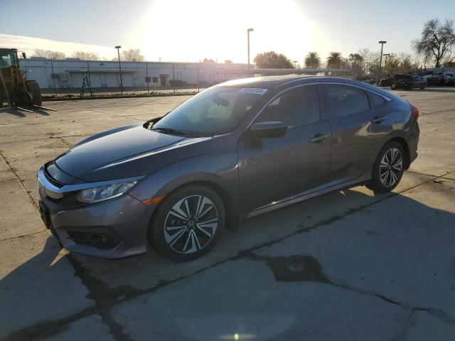 HONDA CIVIC EX 2016 with VIN 19XFC1F38GE216060 - Photo from auction