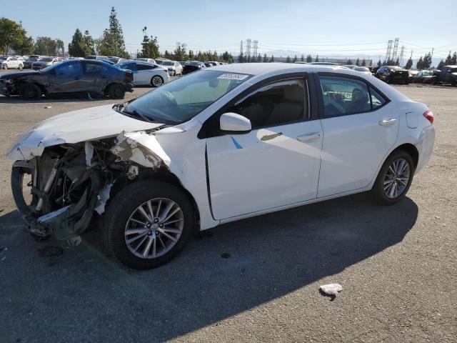 TOYOTA COROLLA L 2014 with VIN 5YFBURHE2EP102074 - Photo from auction