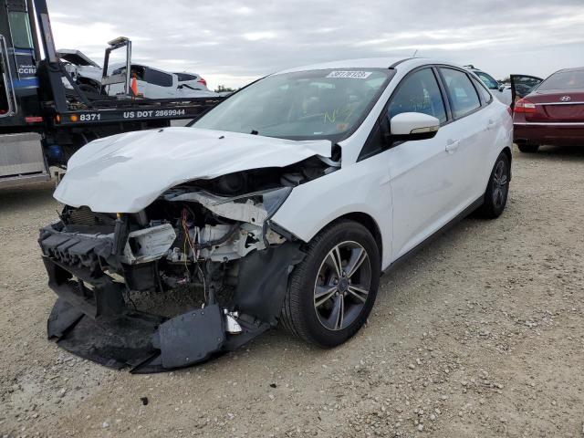 FORD FOCUS SE 2014 with VIN 1FADP3F24EL439608 - Photo from auction