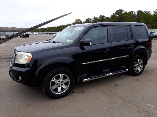 HONDA PILOT TOUR 2011 with VIN 5FNYF4H91BB002422 - Photo from auction