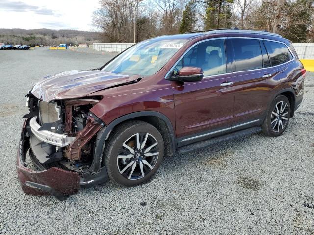 HONDA PILOT TOUR 2021 with VIN 5FNYF5H93MB000180 - Photo from auction