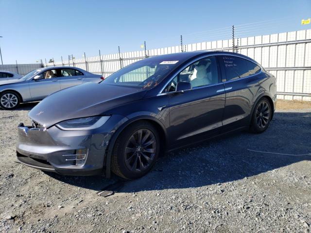 TESLA MODEL X 2018 with VIN 5YJXCDE27JF137267 - Photo from auction