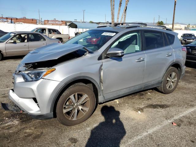TOYOTA RAV4 XLE 2016 with VIN 2T3WFREV0GW297018 - Photo from auction