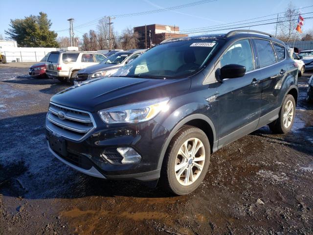 FORD ESCAPE SE 2018 with VIN 1FMCU9GD8JUC53801 - Photo from auction