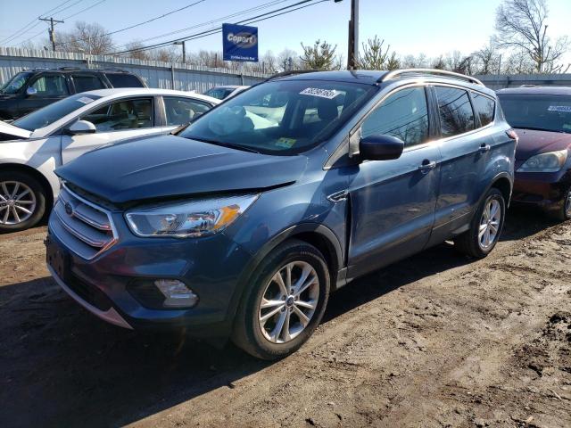 FORD ESCAPE SE 2018 with VIN 1FMCU0GD3JUC87771 - Photo from auction
