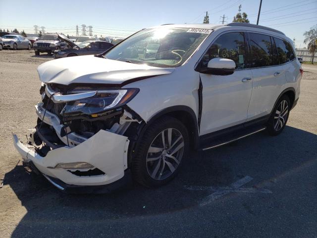 HONDA PILOT TOUR 2017 with VIN 5FNYF5H92HB017462 - Photo from auction