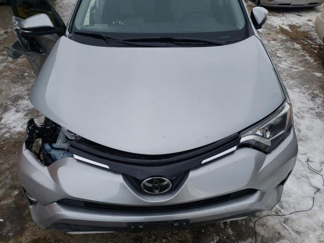 Photo 11 from auction – 2018 TOYOTA RAV4 XLE with VIN JTMRFREV9JJ233689