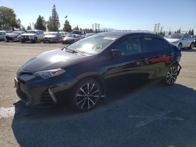TOYOTA COROLLA L 2017 with VIN 5YFBURHE1HP713010 - Photo from auction