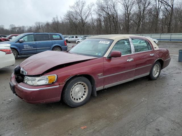 LINCOLN TOWN CAR E 1999 with VIN 1LNHM81W3XY658282 - Photo from auction