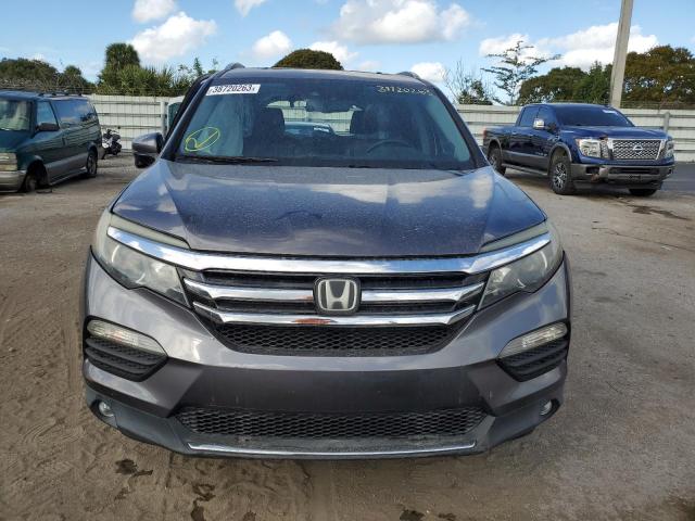 Photo 5 from auction – 2016 HONDA PILOT TOUR with VIN 5FNYF5H95GB017633