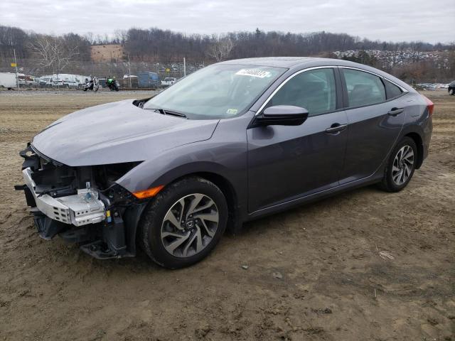 HONDA CIVIC EX 2018 with VIN 19XFC2F70JE035812 - Photo from auction