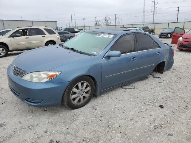 TOYOTA CAMRY LE 2002 with VIN JTDBF32K920012853 - Photo from auction