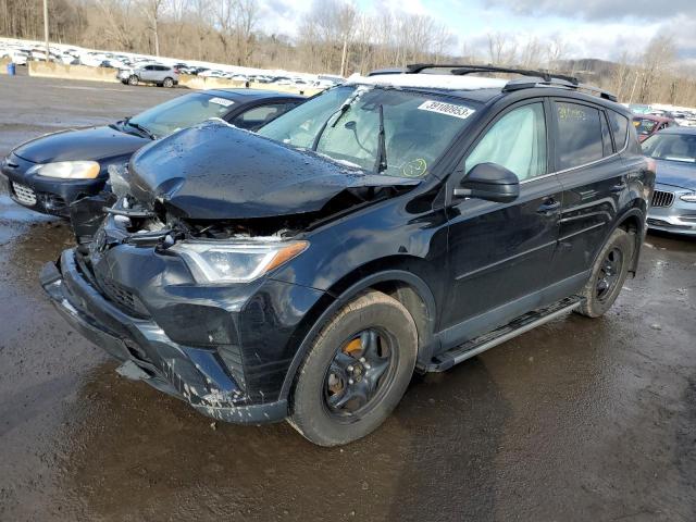 TOYOTA RAV4 LE 2018 with VIN 2T3BFREV6JW780261 - Photo from auction